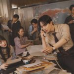 Lee Junho em cena de Typhoon Family mostrando a tensão e desafios da vida corporativa durante a crise financeira.